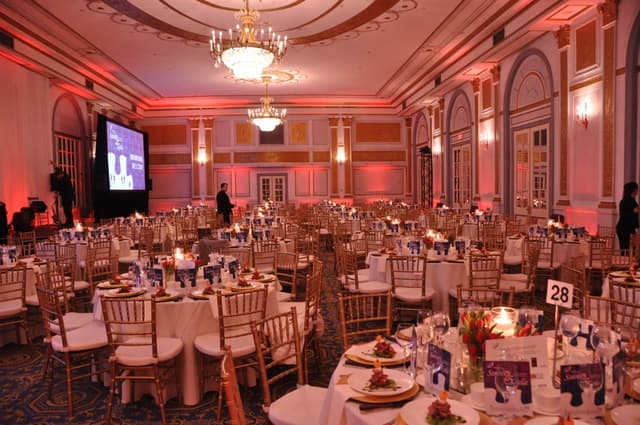 windsor-banquet-hall-montreal-windsor-ballroom-wedding-reception-tables-big-screen-red-lighting.jpg