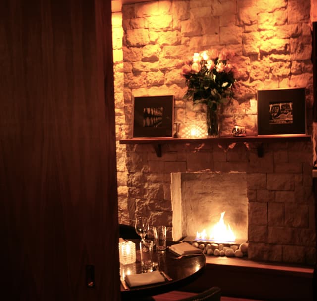 Front Terrace Room Fireplace with Flowers.jpg