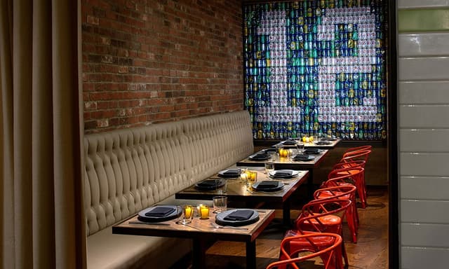 outlier-restaurant-private-dining-with-12s-fans-seattle-beer-can-wall-92624406.jpg