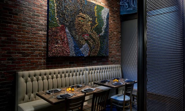 restaurant-private-dining-space-behind-metal-cage-wall-with-red-brick-wall-booth-seatting-and-jimi-hendrix-wall-art-8498ea57.jpg