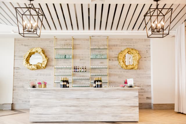 Newport Beach House-Gallery-Bar with gold mirrors and chandeliers in shot_Lefebvre Photography.jpg