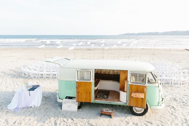 Belle Mer-photo bus on beach in front of ceremony chairs_Move Mountains.jpg
