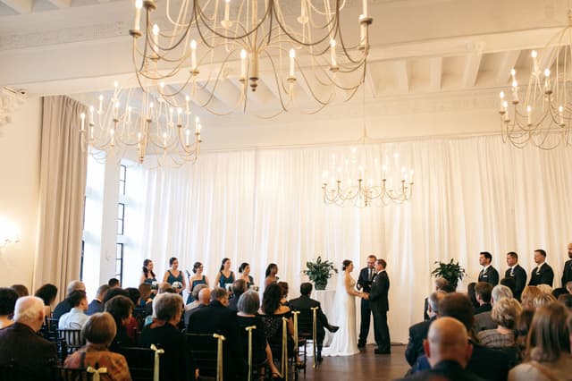 Alden Castle-Vintage Ballroom ceremony-ribbons and potted greens-couple at end of aisle_BaileyQPhoto.jpg