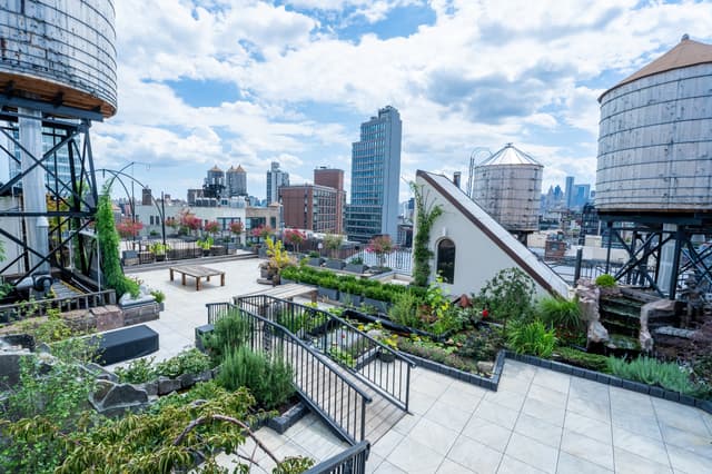 Rooftop Garden In The Sky With Iconic Water Towers