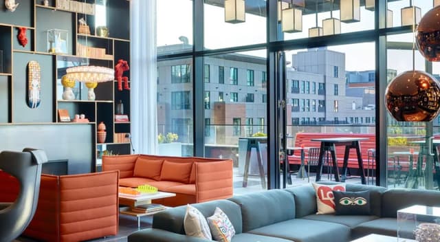 Boston-North-Station-citizenM-living-room-art-wall-statement-lighting-designer-furniture-2.jpg