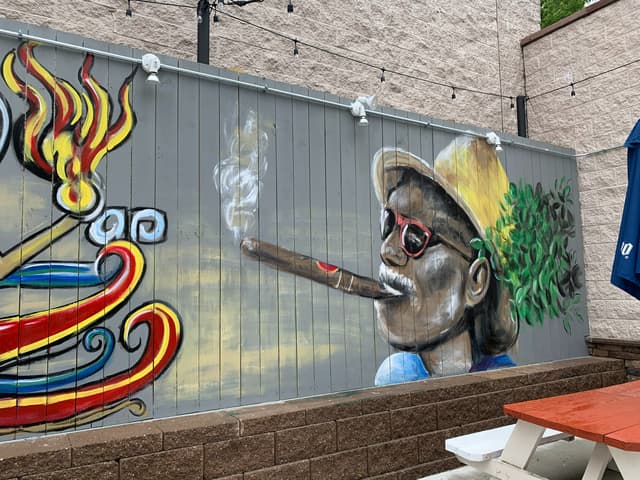 Patio man with cigar.jpg