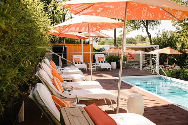 Pool With Cabanas & Chaise Lounges