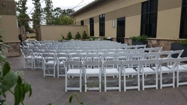 outdoor-courtyard-white-chairs-facing-waterfall.jpg